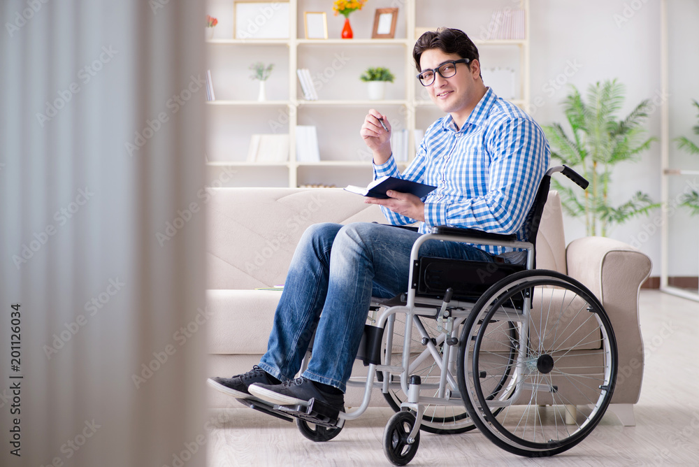 Young student on wheelchair in disability concept Young student on wheelchair in disability concept