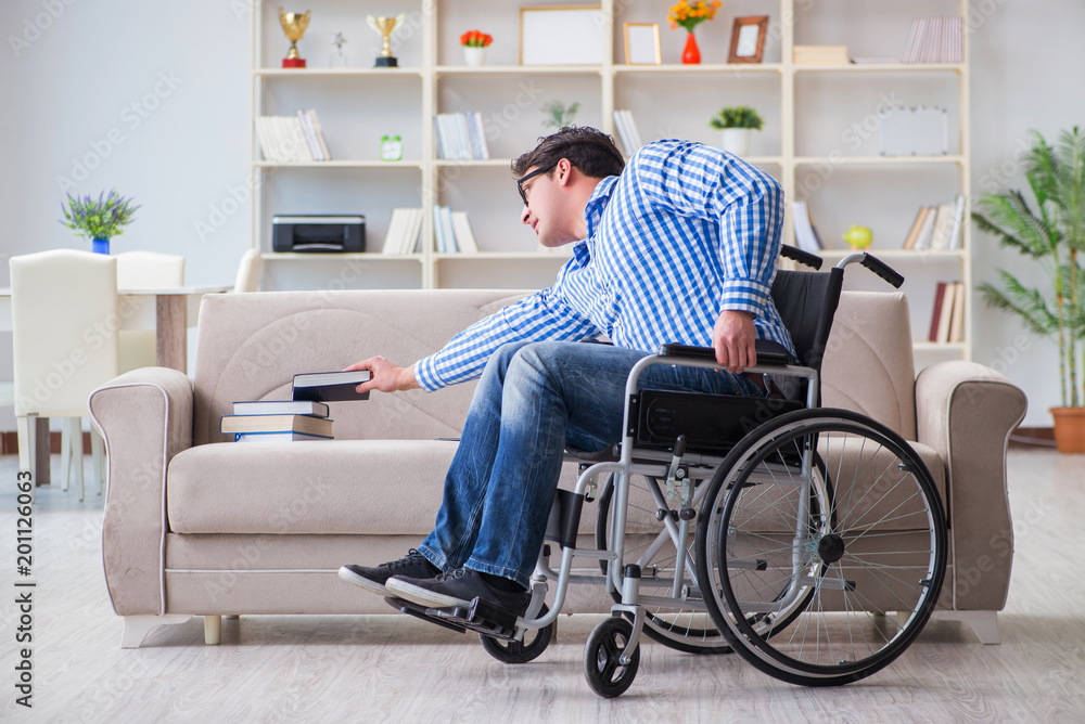 Young student on wheelchair in disability concept Young student on wheelchair in disability concept