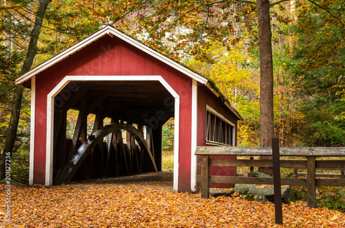 Traditional Covered Bridge in an Forest in Autumn. Southford Falls State Park, CT photo
