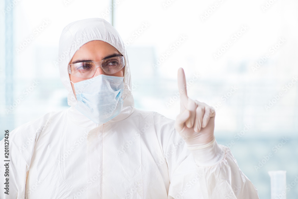 Young chemist pressing virtual buttons in lab Young chemist pressing virtual buttons in lab