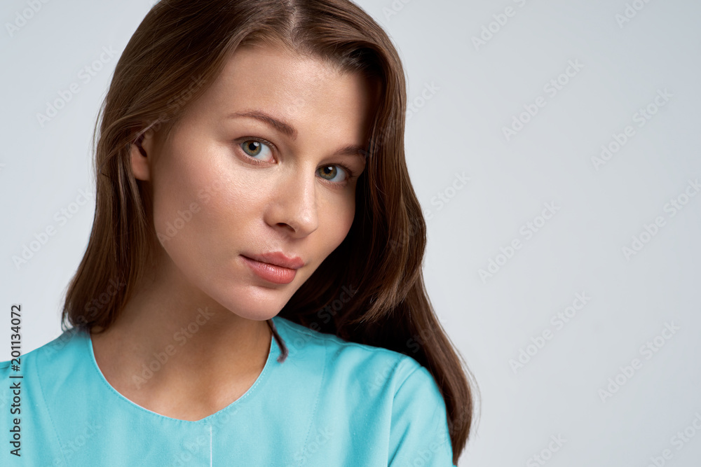 large Studio portrait of a young beautiful woman with dark hair and clean healthy skin. Expressive eyes and calm expression large Studio portrait of a young beautiful woman with dark hair and clean healthy skin. Expressive eyes and calm expression