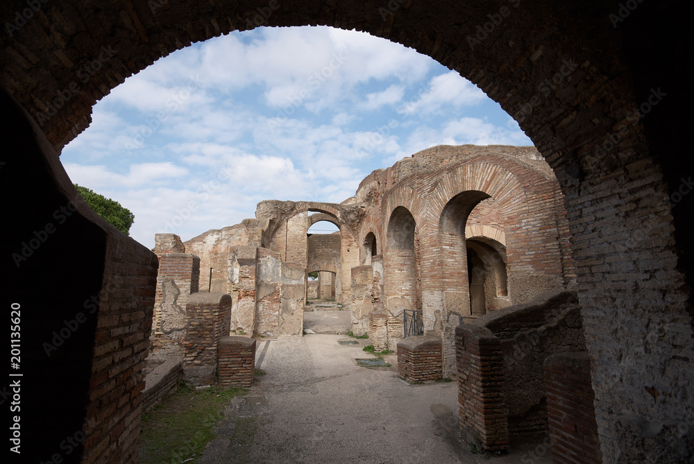 The ruins of Ostia Antica, framed in an arch, Italy.