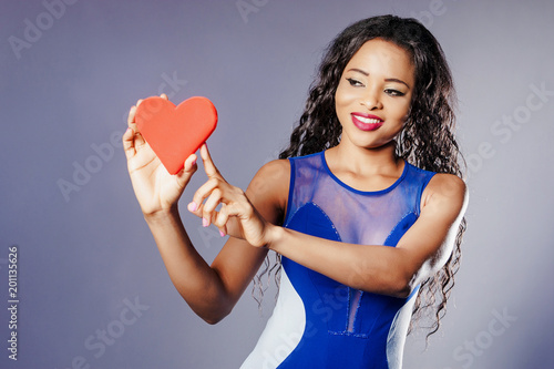 Love. The girl shows a red ...