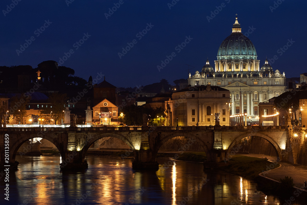 St Peter's and the Tiber river at night, Vatican, Rome, Italy.