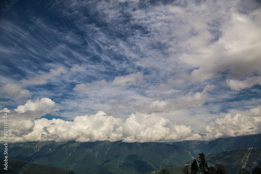 tops of mountains with beautiful clouds