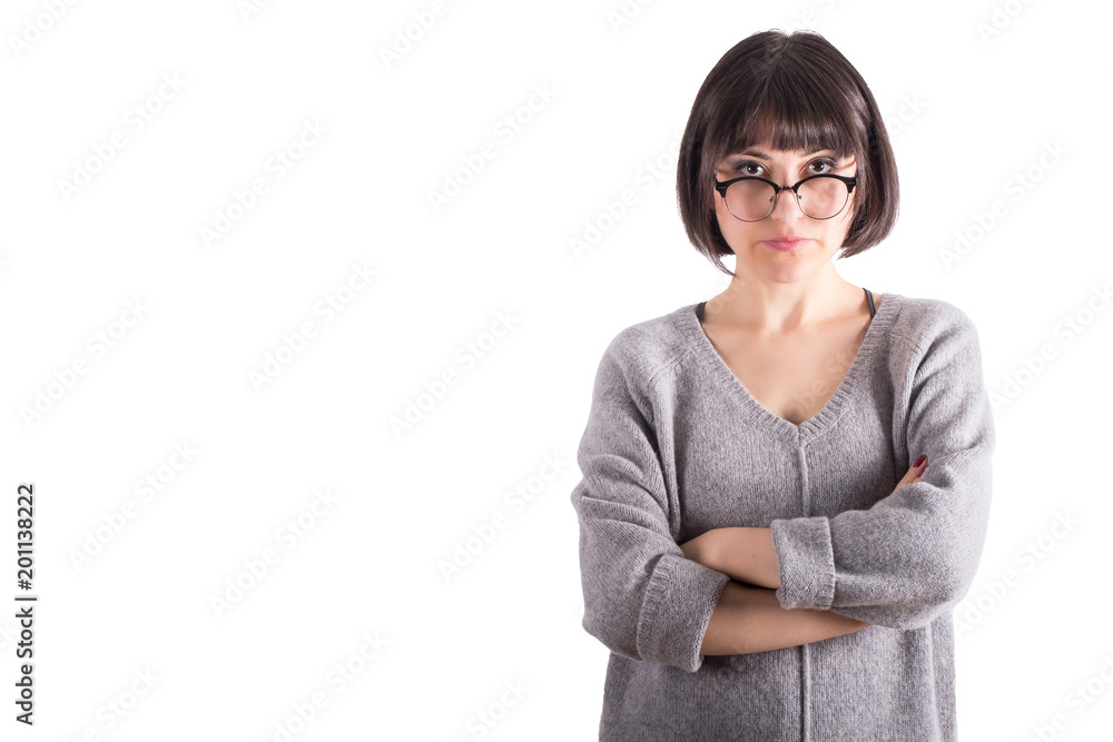 Young Woman Looking at the Camera Sharply with Crossed Arms Young Woman Looking at the Camera Sharply with Crossed Arms