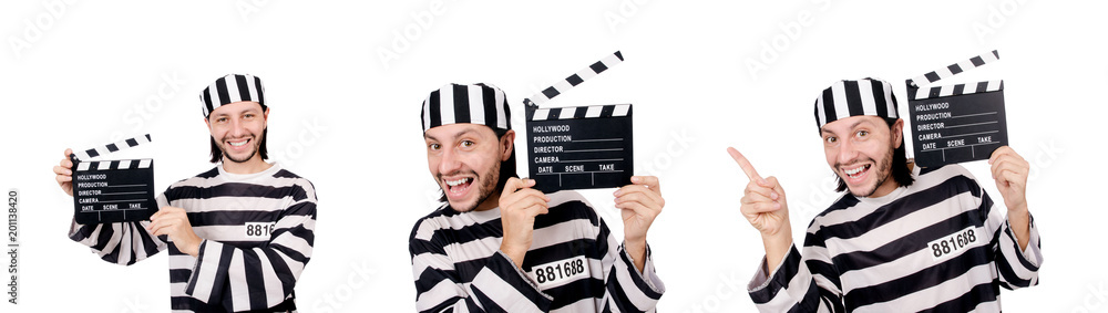 Funny prison inmate with movie board isolated on white Funny prison inmate with movie board isolated on white