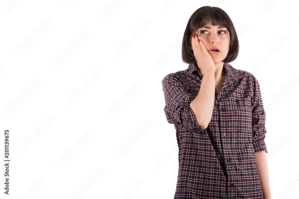 Young Woman Holding Her Cheek in Shock Young Woman Holding Her Cheek in Shock