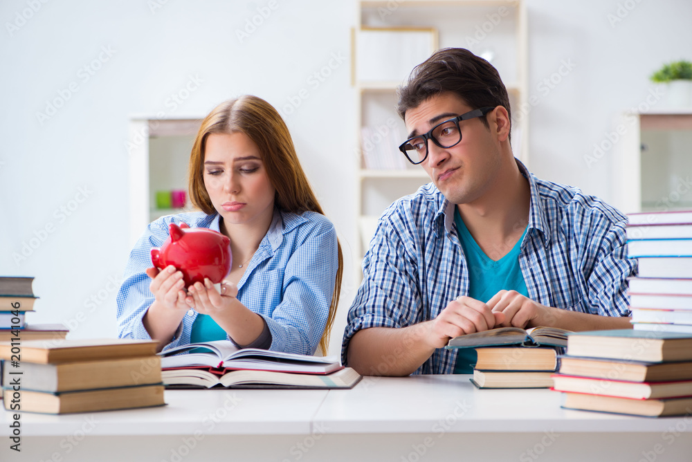Two students checking savings to pay for education Two students checking savings to pay for education
