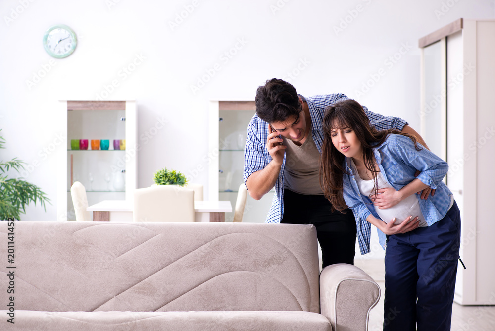 Pregnant woman with husband at home Pregnant woman with husband at home