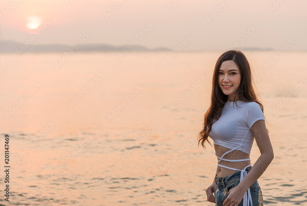 woman enjoy on sea beach with sunset woman enjoy on sea beach with sunset