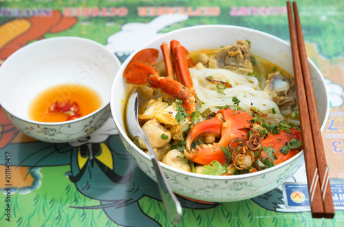 A bow of vietnamese rice noodle soup photo
