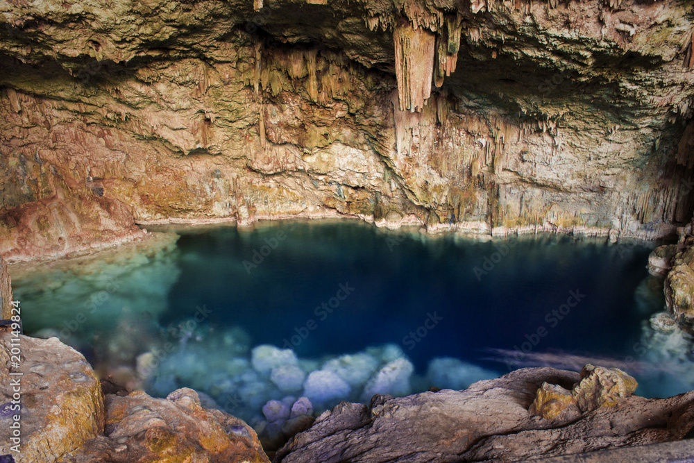 beautiful natural pool of crystal clear water formed in a rocky cave with stalagmites and stalagmites beautiful natural pool of crystal clear water formed in a rocky cave with stalagmites and stalagmites