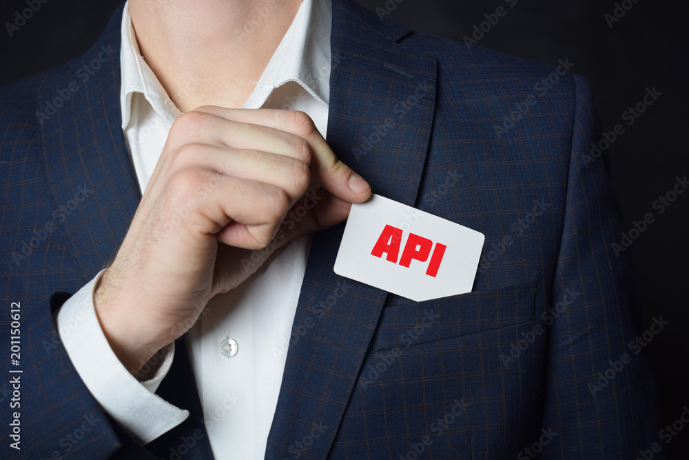 Businessman shows business card with the inscription:API Businessman shows business card with the inscription:API