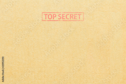Cardboard box background with Top secret stamp