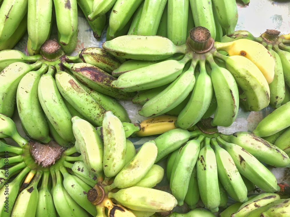 Banana bunches on a table at the farmers market in Hawaii 