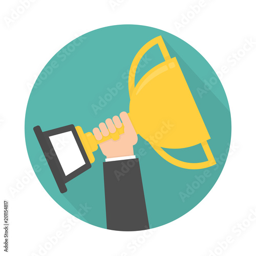 Hand holding and rising up golden trophy icon. Circle shaped with long shadow