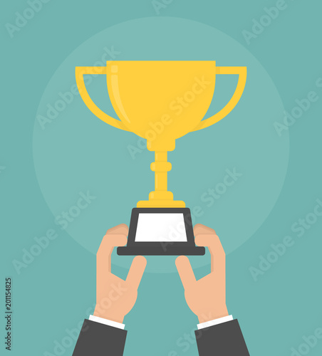 Hand holding and rising up golden trophy. Challenge completed concept