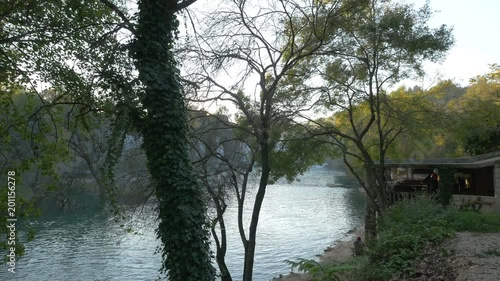 Trebi≈æat River seen through trees photo