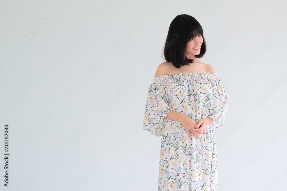 Fashion Portrait of Young asian woman with short hair style wearing vintage Floral dress - copy space white background Fashion Portrait of Young asian woman with short hair style wearing vintage Floral dress - copy space white background
