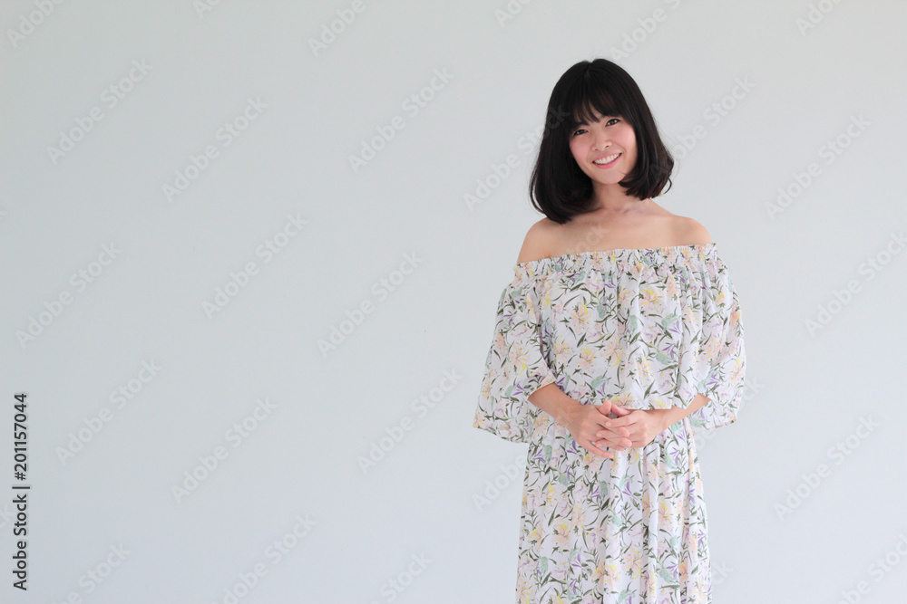 Fashion Portrait of Young asian woman with short hair style wearing vintage Floral dress - copy space white background Fashion Portrait of Young asian woman with short hair style wearing vintage Floral dress - copy space white background