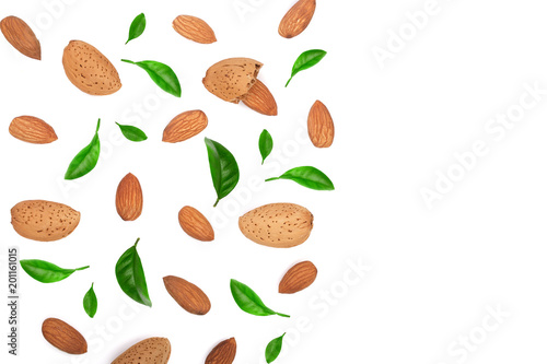 almonds decorated with leaves isolated on white background with copy space for your text. Top view. Flat lay pattern