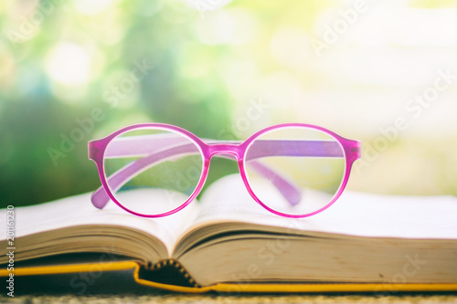 Eyeglasses placed on an ope...