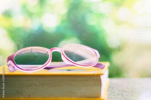 Eyeglasses placed on a book...
