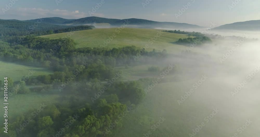Aerial shot of the forested, hazy mountains, spring, 4k Aerial shot of the forested, hazy mountains, spring, 4k