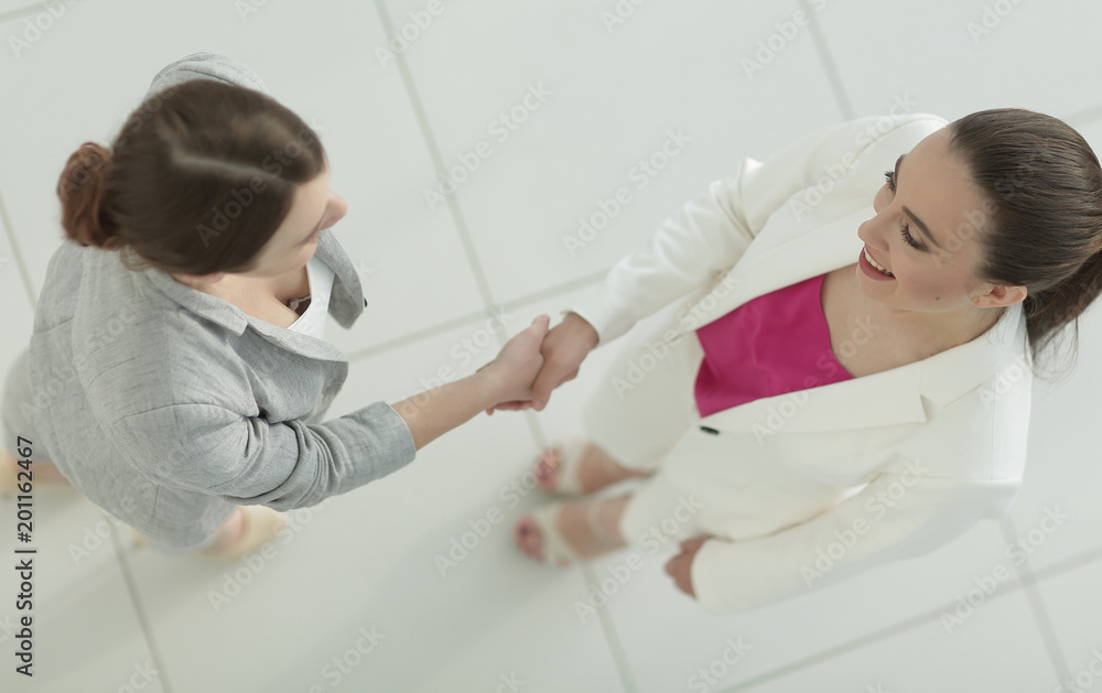 view from the top. handshake elegant business women view from the top. handshake elegant business women