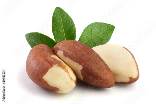 Brazil nuts with leaves isolated on white background closeup. Full depth of field