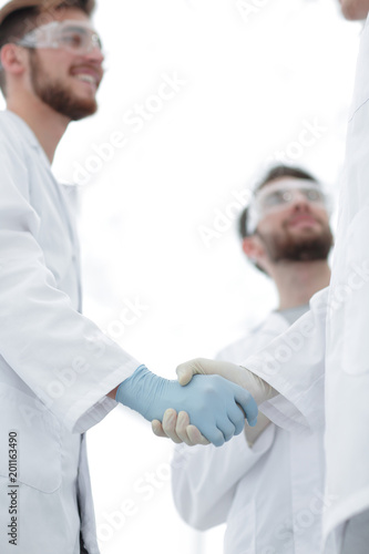 Cropped shot of medical workers shaking hands