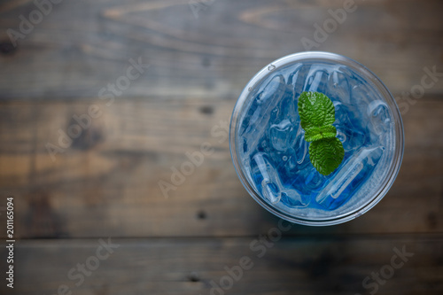 glass of Iced blue hawaii soda on table