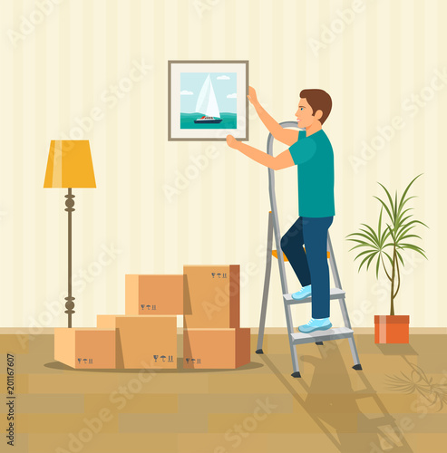 Man hanging picture on the wall. Moving boxes in new house. Vector flat style illustration.