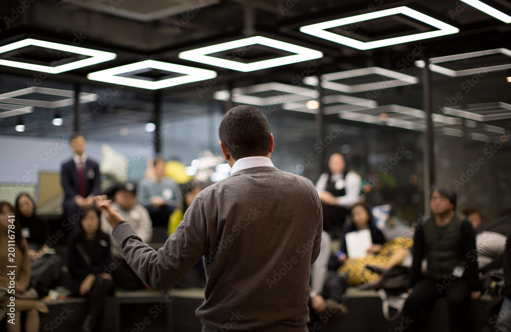 Fototapeta premium Man Presenting to Group of People