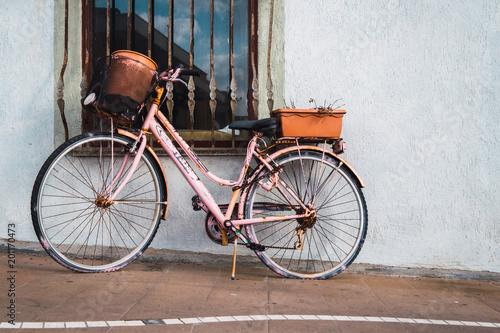 Pink vintage bicycle on street photo