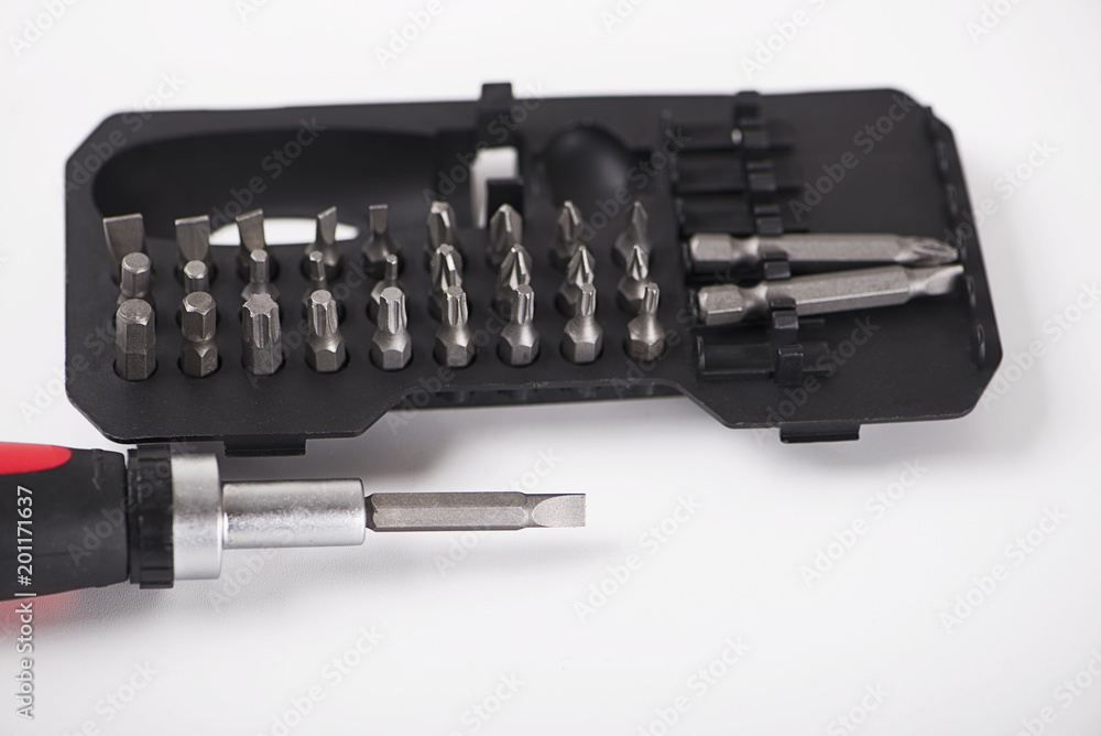 Close-up of set of heads for screwdriver on white background. Isolated. Industry. Close-up of set of heads for screwdriver on white background. Isolated. Industry.