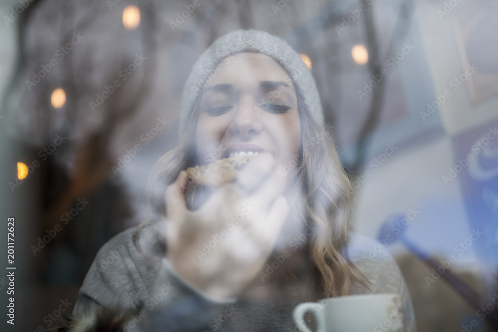 Woman biting cookie Woman biting cookie