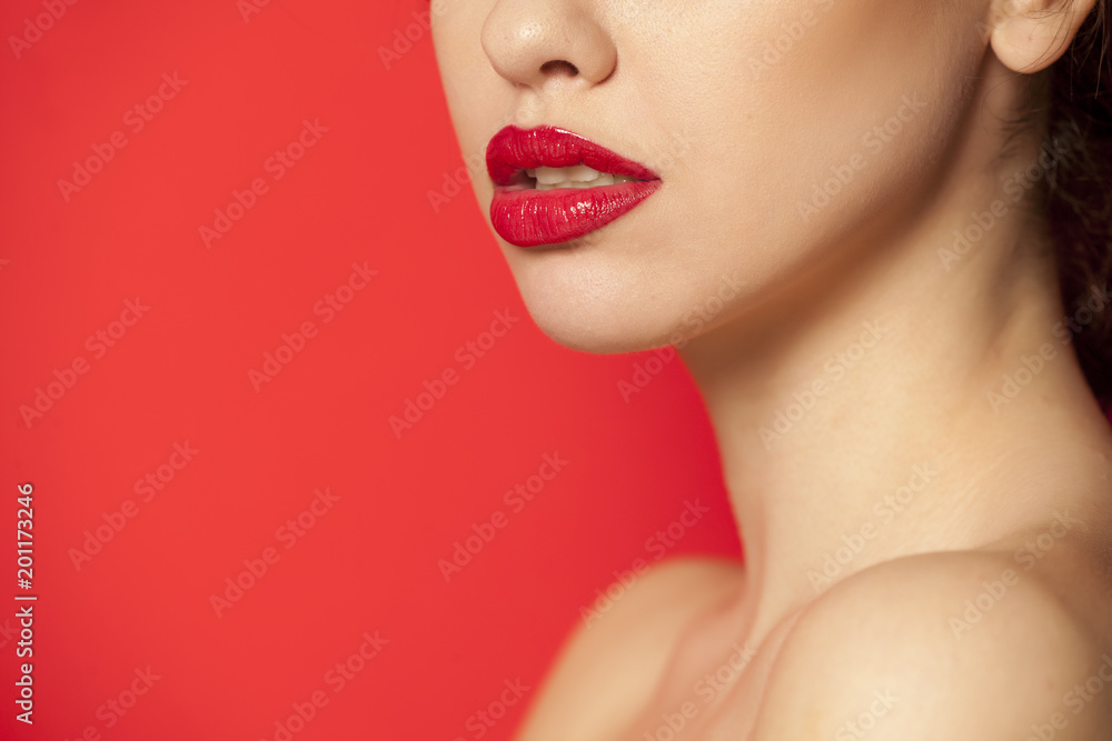 red glossy lipstick on red background red glossy lipstick on red background