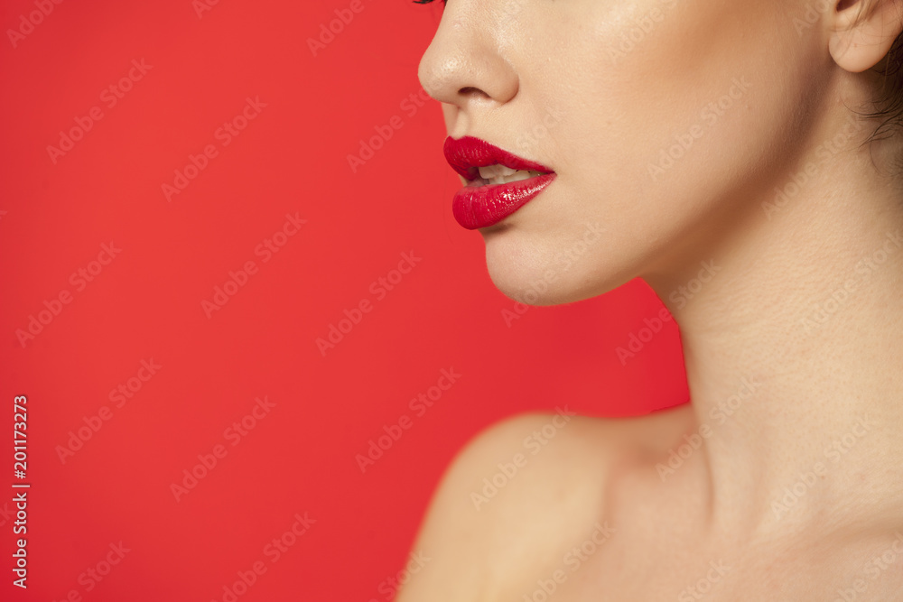 red glossy lipstick on red background red glossy lipstick on red background