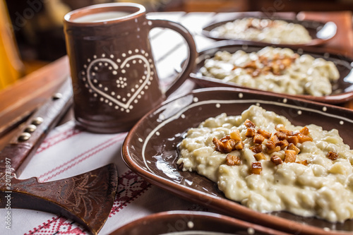 Traditional slovakian food Halusky with fried bacon and decoration photo