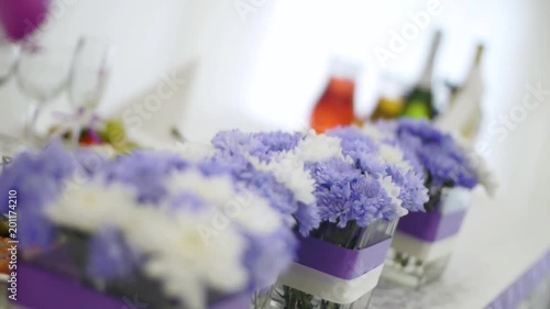 Flowers in glass pots, selective focus. Clip. photo