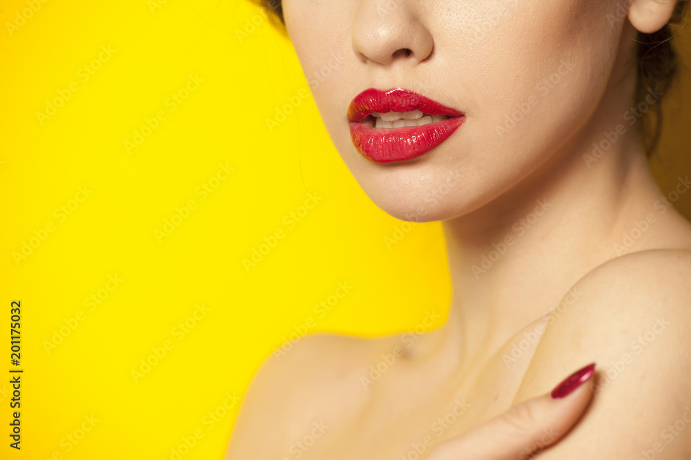 red glossy lipstick on yellow background red glossy lipstick on yellow background