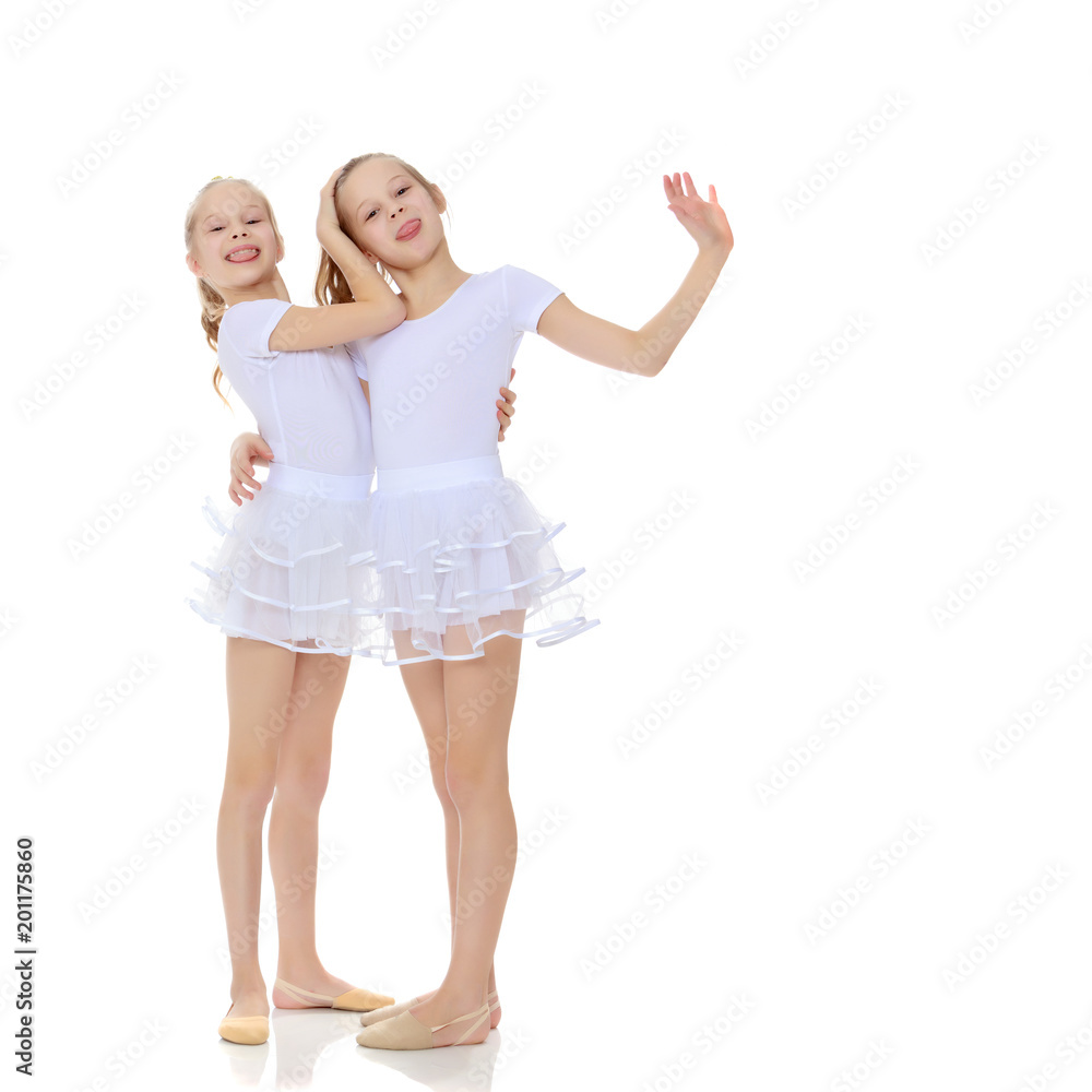 2 girls gymnast in white suits. 2 girls gymnast in white suits.