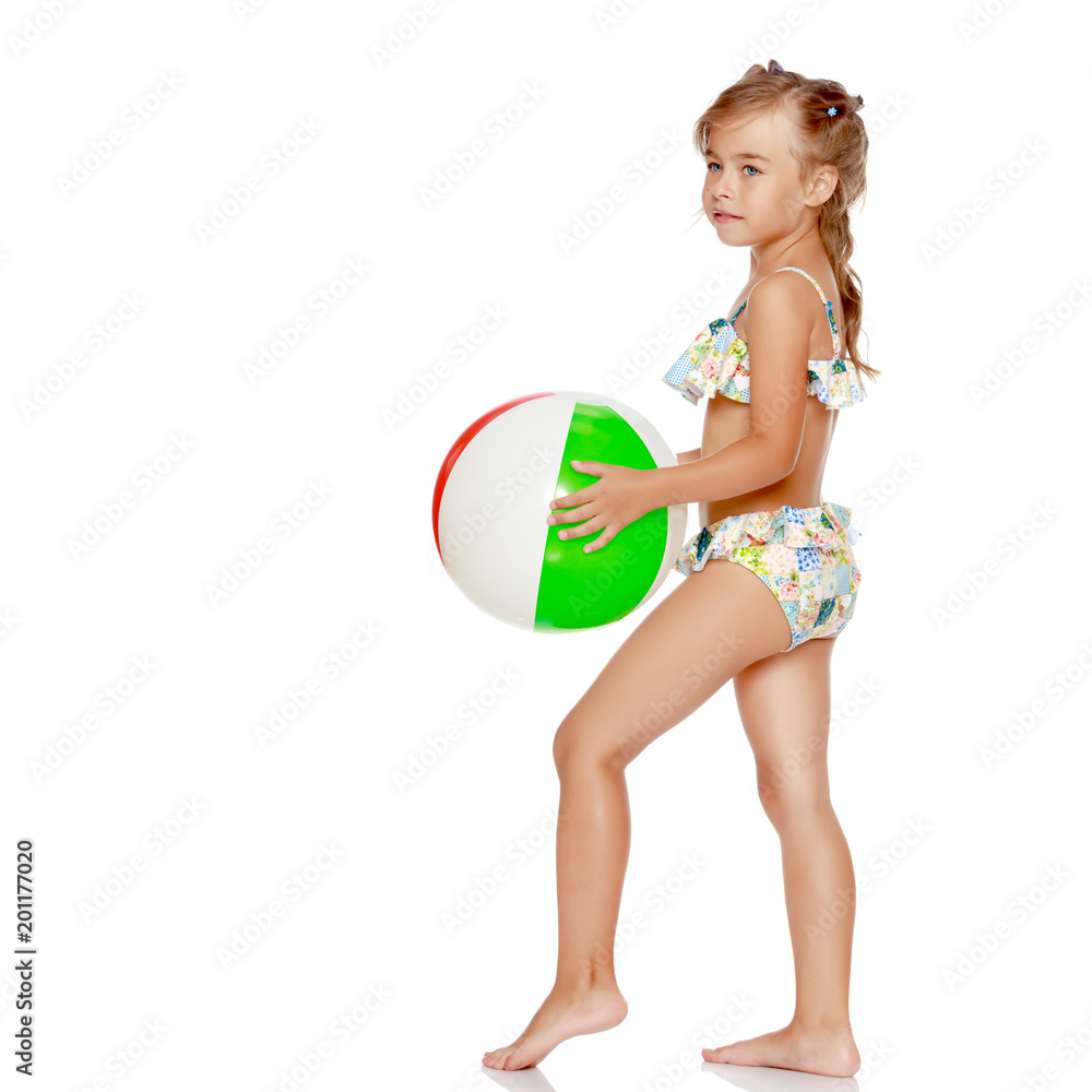 Little girl in a swimsuit with a ball Little girl in a swimsuit with a ball