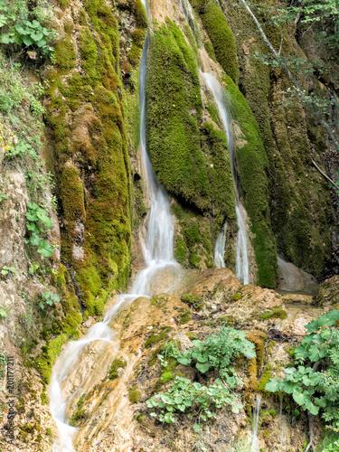 Beautiful landscape of a waterfall with green moss  Alba  Romania