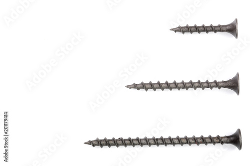 black screws isolated on white background with copy space for your text. Top view.