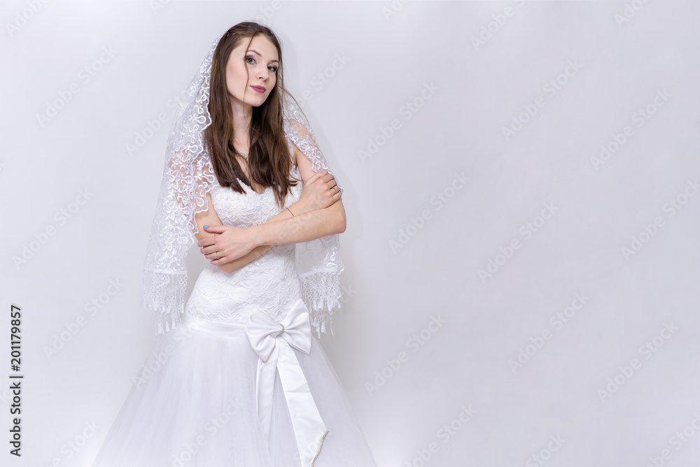 beautiful bride in white wedding dress in different poses on white backgrounds shows different emotions beautiful bride in white wedding dress in different poses on white backgrounds shows different emotions