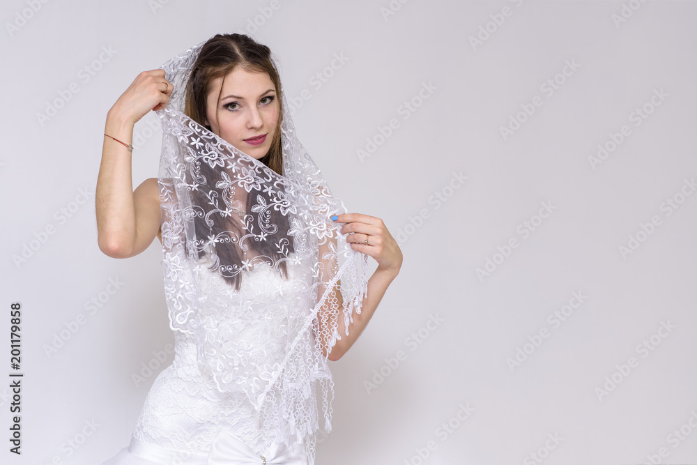 beautiful bride in white wedding dress in different poses on white backgrounds shows different emotions beautiful bride in white wedding dress in different poses on white backgrounds shows different emotions