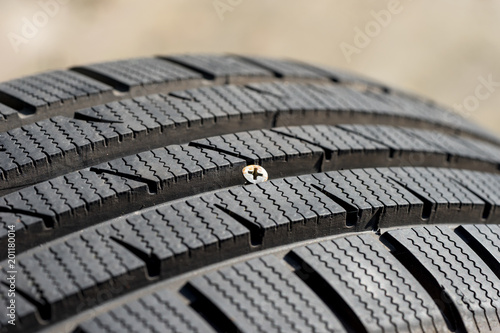 metal screw in damaged tyre before repair